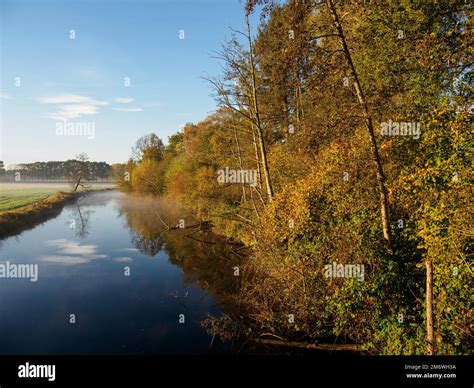Autumn at a river in germany Stock Photo - Alamy