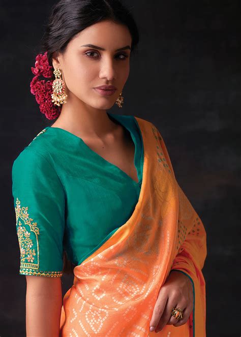 MELON ORANGE WOVEN PURE BRASSO CHIFFON SAREE WITH EMBROIDERED SILK BLO ...