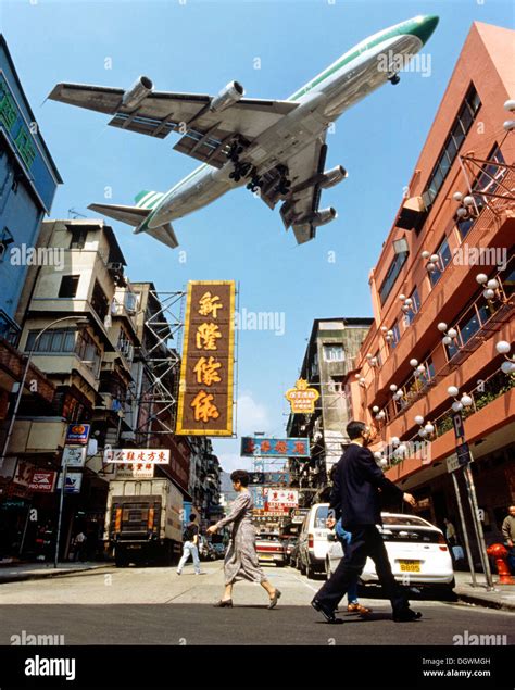 Cathay Pacific aircraft approaching Kai Tak Airport over the rooftops ...