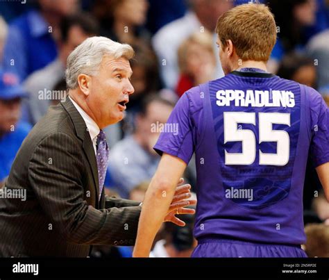 Kansas State head coach Bruce Weber talks with guard Will Spradling (55 ...
