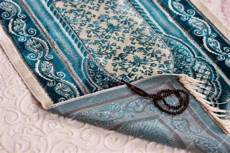 Praying in the month of ramadan prayer rugs laid on the ground islam ...