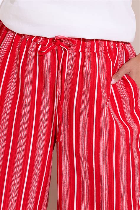YOURS Plus Size Red Textured Stripe Wide Leg Trousers | Yours Clothing