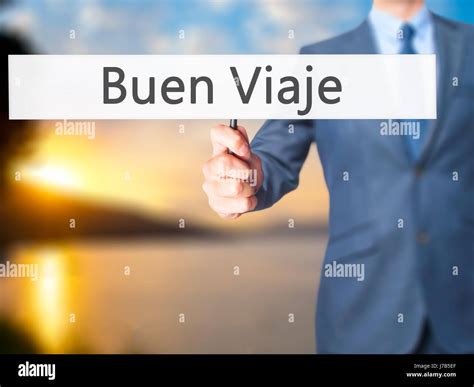 Buen Viaje (Good Trip in Spanish) - Businessman hand holding sign ...