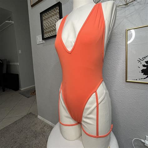 Orange one piece swimsuit bodysuit With attached... - Depop
