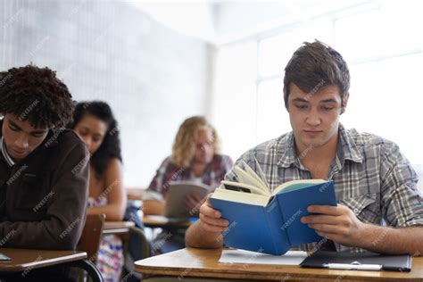 Premium Photo | University book and man in classroom reading for ...