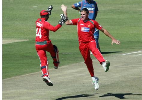 Tatenda Taibu and Raymond Price celebrate the dismissal of Yusuf Pathan ...