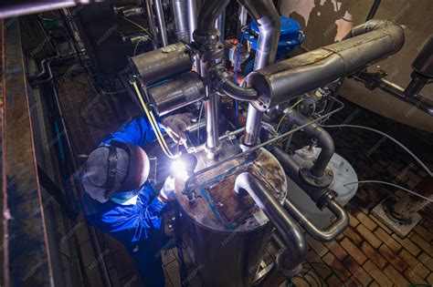 Premium Photo | Welding arc argon worker male repaired metal is welding ...