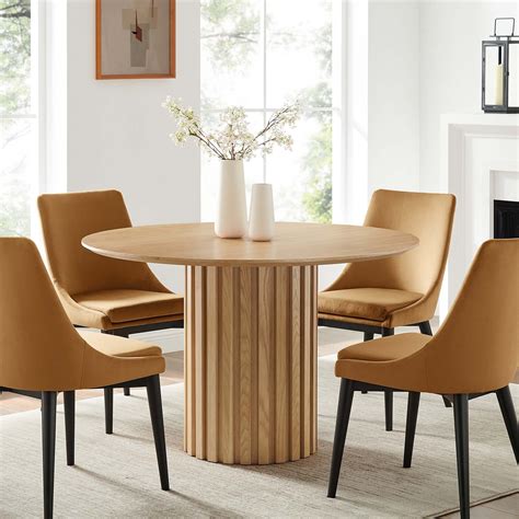 10 Stunning Round Dining Tables For Small Spaces