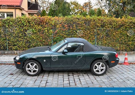 Old Classic Veteran Vintage Small Dark Green Convertible Car Mazda MX-5 Parked Editorial Stock ...