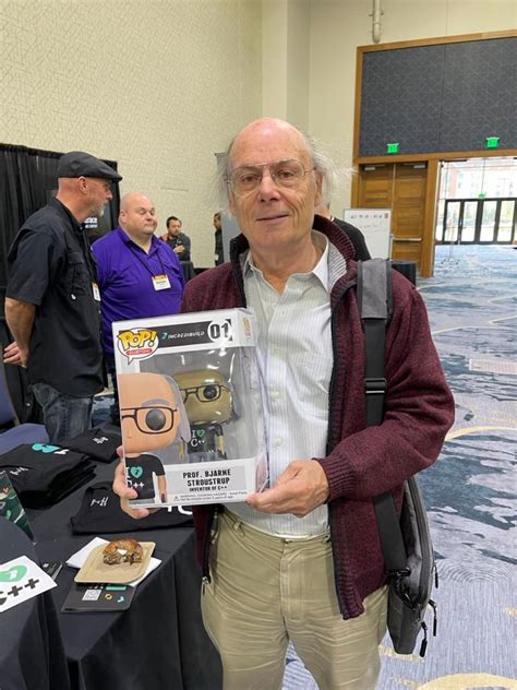 It’s just Bjarne Stroustrup (the guy who invented C++) holding his Pop head, wearing an ...