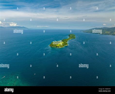 Seascape with a piece of land surrounded by water. Samal Island. Davao ...