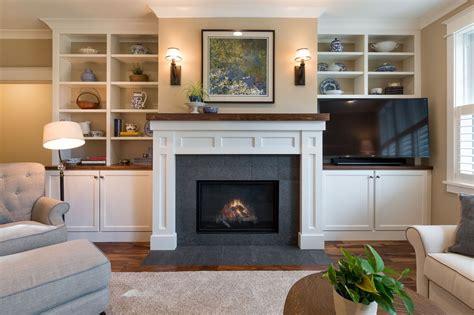 Blue and White Fireplace with Shelving and Cabinets by Bouwkamp Builders