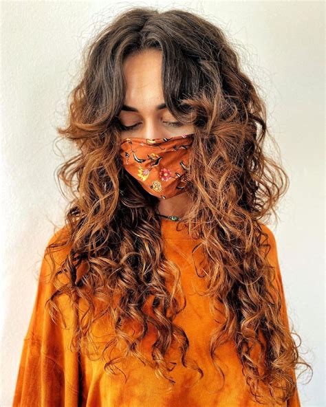 Long Highlighted Curly Hair with Curtain Bangs Curly Shag Haircut ...