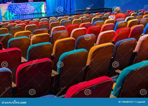 The Auditorium in the Theater. Multicolored Spectator Chairs Stock ...
