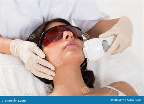 Beautician Giving Epilation Laser Treatment Stock Image - Image of acne, electrolysis: 54655677