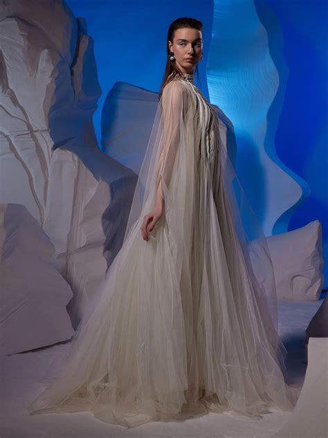 Ivory gown featuring pleating textured details. – samantchauhan