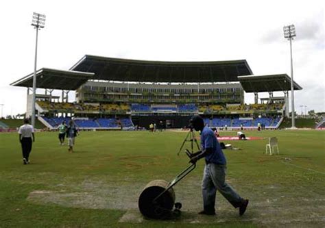 Ground staff work at getting the ground ready for play | ESPNcricinfo.com