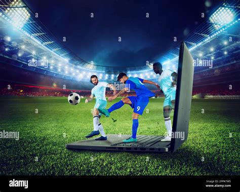 Soccer players play on a laptop, concept of tv streaming Stock Photo ...