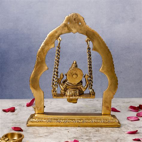 The Advitya | Brass Yali Jhula with Ganesha Sitting on it