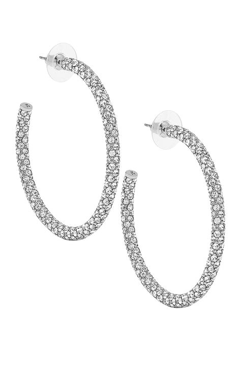 AMINA MUADDI Cameron Hoop Large Earrings in Silver & White Crystal | FWRD