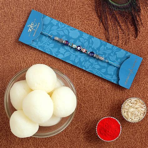 Send Evil Eye Designer Rakhi & Rasgulla Tin Online | Rakhibazaar.com