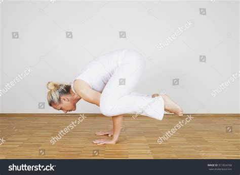 Woman Praciticing Yoga Crow Pose Kakasana Stock Photo 311824748 ...