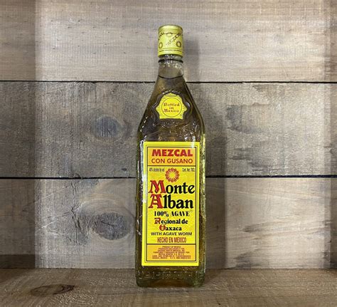Download free Monte Alban Mezcal Tequila Beside Wooden Wall Wallpaper ...
