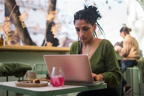 "Woman Working On Her Computer" by Stocksy Contributor "Felix Chacon" - Stocksy