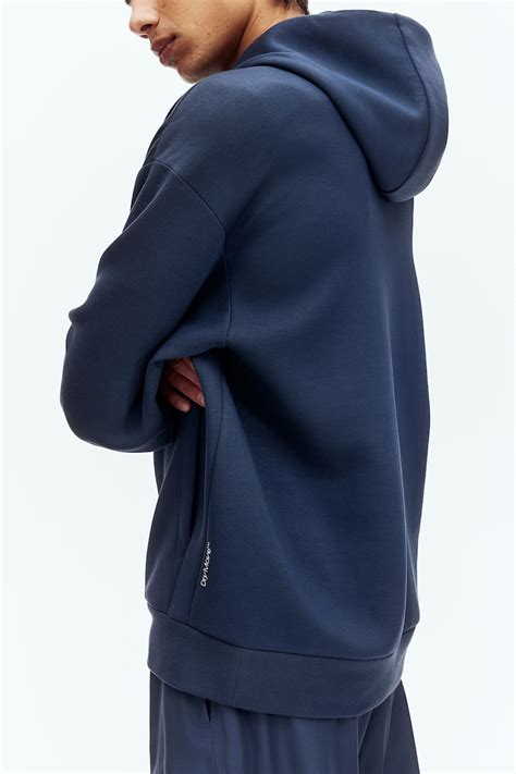 Loose Fit Sports hoodie with DryMove™ - Navy blue - Men | H&M IN