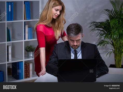 Hot secretary sucks a big cock and gets a big load of cum in her mouth and on her tits