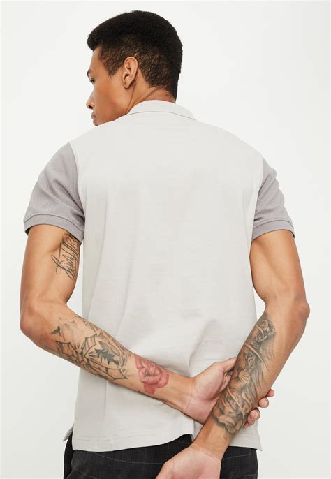 Buy Men Slim Fit Colourblocked Polo T-shirt Online at just Rs. 799.0 ...