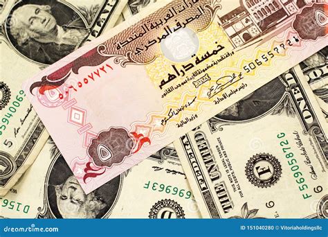 A One Jordanian Dinar on a Background of American One Dollar Bills ...