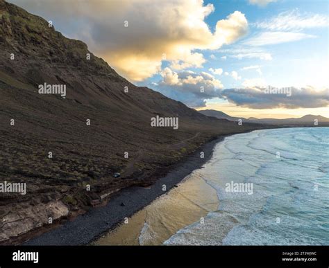 Breathtaking views of Caleta da Famara, Lanzarote. Volcanic cliffs meet ...
