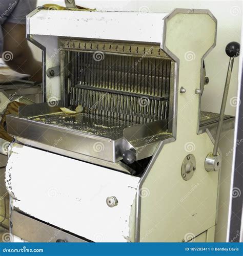 Commercial bread slicer stock image. Image of sliced - 189283411
