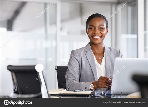 Businesswoman Sitting in Office Stock 的图像结果