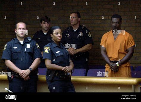 Daniel Franklin, right, stands in 50th District Court in Pontiac, Mich ...