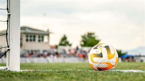 Download Yellow And White Soccer Ball Picture | Wallpapers.com