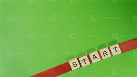 Diagonal Word START with Wooden Letter Tiles on Red Ribbon and Green ...