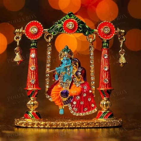 Buy Vibrant Radha Krishna Idol with Jhula Online in India - Mypoojabox.in