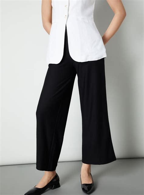 Buy Women Solid Wide Leg Trousers Online at just Rs. 1299.0 ...