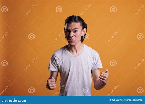 Man Clenching Fists with Furious Facial Expression Stock Photo - Image ...