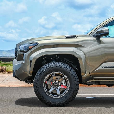 Lifted Toyota Tacoma Looks Great Even in Bronze When Dressed Properly With Graphite Wheels ...