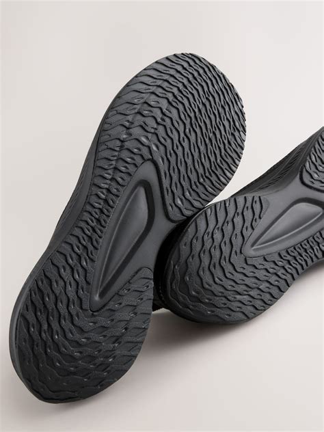 Buy Black Knitted Trainers from Next India