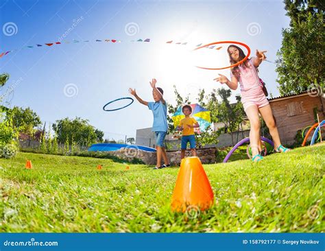 Kids Target Practice with Hula Hoops Rings Game Stock Image - Image of ...