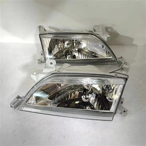FARO DELANTERO CORONA PREMIO 99-00 LH