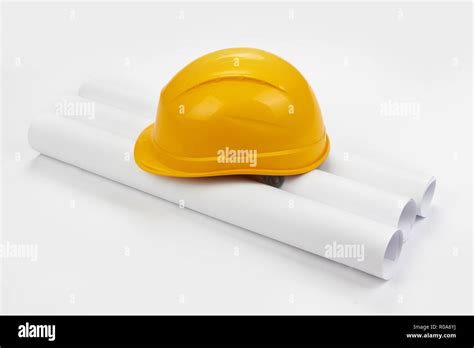 Drawings and hard hat on white Stock Photo - Alamy