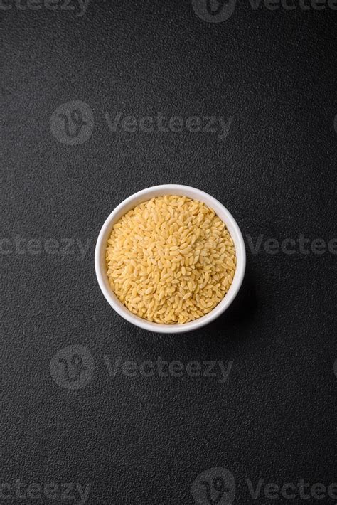 Raw whole grain orzo pasta as an ingredient for a delicious dish ...
