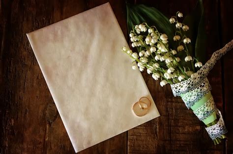 Vintage photo wedding bouquet of lilies of the valley and ring ...