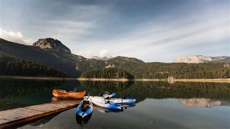 Download wallpaper 3840x2160 boats, mountains, lake, pier, starry sky ...