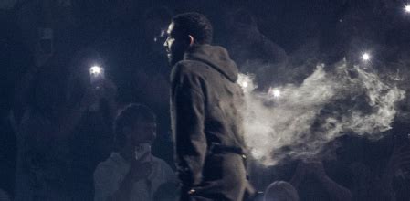 +WATCH: Drake pulls up in a smoke-filled, bullet-holed hoodie in Australia